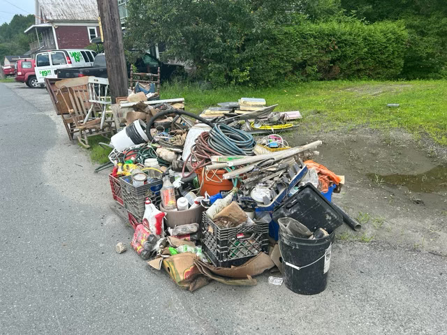 A photo of a pile of trash left on the curb after the July 10, 2024 floods